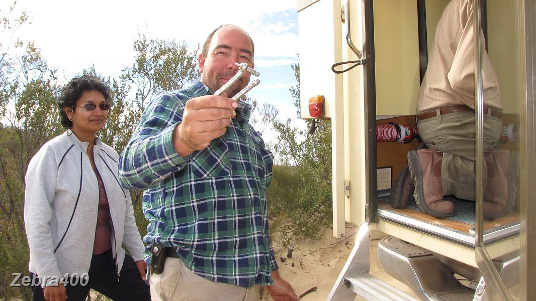 25-Shane finds the old U bolt a little out of shape.JPG